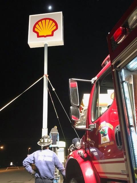 Following a night of strong winds, a local Shell station's sign was damaged. Members of the Upper Pine River Fire Protection collaborated with welders in the community to fix the sign. 