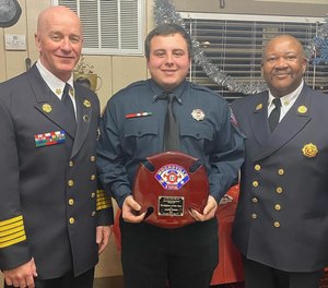 Firefighter Austin Freidt (center).