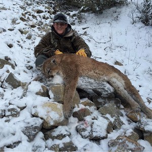 Ty Dillon with a mountain lion he shot.
