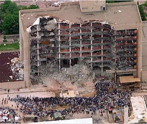 In this May 5, 1995 file photo, a large group of search and rescue crew attends a memorial service in front of the Alfred P. Murrah Federal Building in Oklahoma City. (AP Photo/Bill Waugh, Flle)