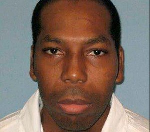 a. This undated file photo from the Alabama Department of Corrections shows inmate Dominique Ray .