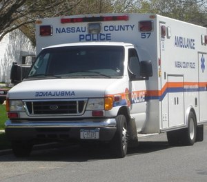 Nassau County police say a drunk driver struck a police department ambulance while driving the wrong way, injuring a police medic and fleeing the scene.