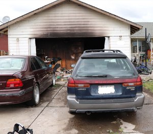 An off-duty Bend firefighter-paramedic rescued a disabled woman from a burning home on Friday.