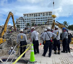 A Technical Rescue Team from New Jersey stages nearby the scene.