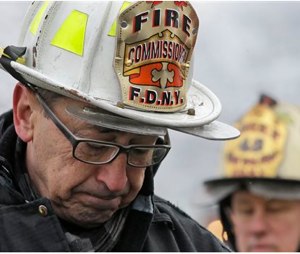 New York's Fire Commissioner Daniel Nigro describes the fire to reporters during a news conference Saturday. (AP Photo/Mary Altaffer)