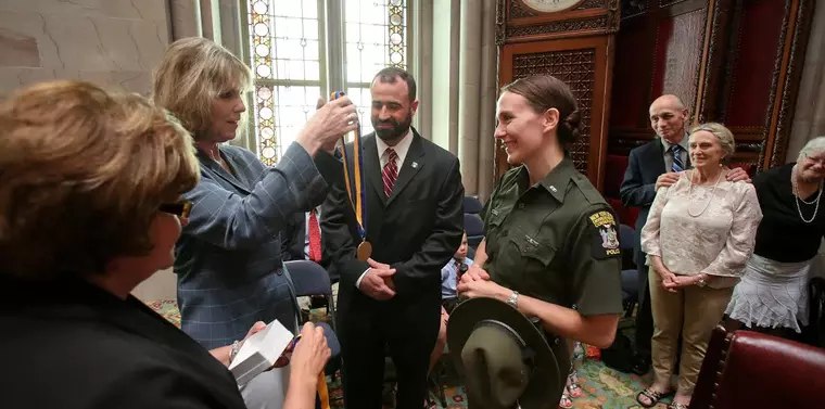 NY DEC Officer Davey and Lt. Bobseine receive medals for their bravery and service.