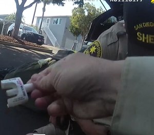 Deputies prepare to give a dose of intranasal naloxone to a deputy they believed had overdosed after an accidental exposure to fentanyl