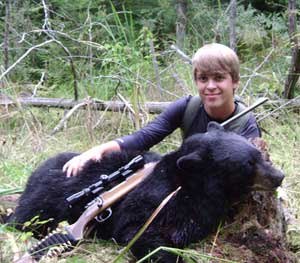 Nathan Stuckey, son of fallen officer Paul Stuckey's two sons on this year's hunt was posing for pictures 1500 hours on opening day with the bear he harvested minutes earlier.