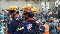 US fire rescue team pulls woman from collapsed 4-story building in Nepal