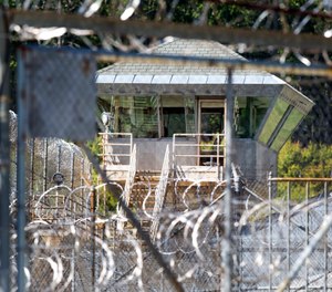 This Friday, June 17, 2016, photo, shows the guard tower at the New Hampshire state prison in Concord, N.H. (AP Photo/Jim Cole)