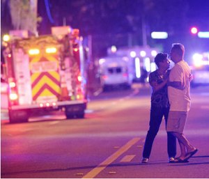 Family members wait for word from police after arriving down the street from a shooting involving multiple fatalities at Pulse Orlando nightclub. (AP Photo/Phelan M. Ebenhack)