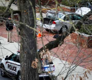 A car inside a police line sits on the sidewalk as authorities respond to an attack on campus at Ohio State University, Monday, Nov. 28, 2016, in Columbus, Ohio. (AP Photo/John Minchillo)