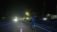 Video: Semi drives through downed power lines near Tenn. cops directing traffic