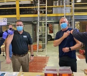 Oklahoma City Fire Chief Richard Kelley and Local 157 Union President Cameron Weems receive the COVID-19 vaccine on Saturday.