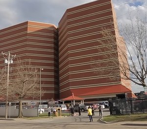 Emergency responders can be seen outside the Oklahoma County Jail after a detention officer was taken hostage on March 27. The kidnapping and how it ended led to new and harsher criticism of the jail trust, which took over operations of the aging 13-story facility in July.
