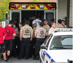 EMS first response personnel are seen outside a hotel, which turned into a hub for families and friends waiting to hear about loved ones because of its proximity to the Orlando Regional Medical Center.