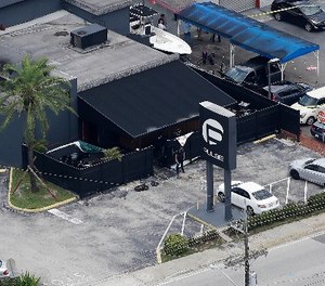 In this June 12, 2016 file photo, law enforcement officials work at the Pulse gay nightclub in Orlando, Fla., following the a mass shooting.