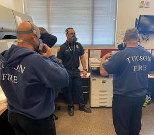 Crews are fitted for P-100 respirator masks.