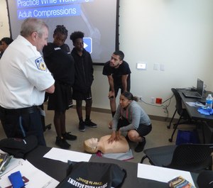 Training coordinators broke the cadets into teams to teach hands-on instructions on resuscitation and blood loss prevention.(Photo/Armstrong Ambulance)