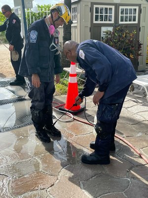 A technical rescue team (TRT) member goes through decon after a shift on the pile.