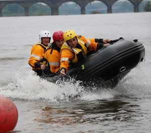 Waterways Conservation Officers with the Pennsylvania Fish and Boat Commission have established the Swift Water Emergency Response Team (SWERT). Here they practice high-speed recovery.
