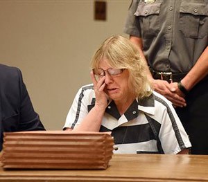 Joyce Mitchell cries as she sits with her attorney Stephen Johnston in court on Tuesday July 28, 2015 in Plattsburgh, N.Y.