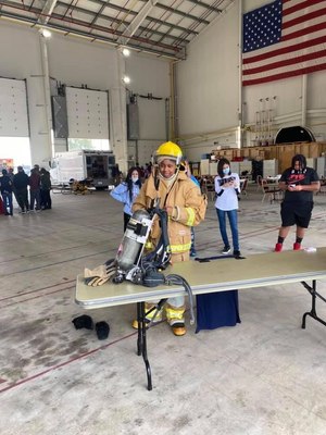 Empress Hughley-Harris dons PPE.