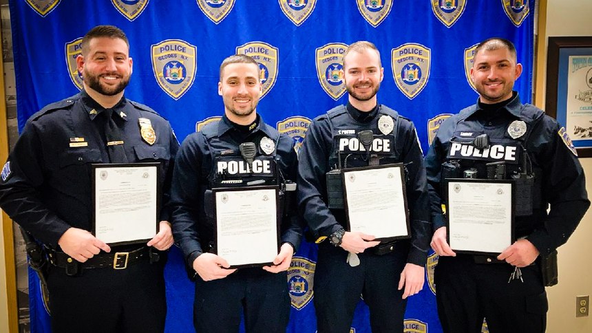 Geddes Police Sgt. Michael Borell and Solvay Police Officers Adam Lustrinelli, Taylor Potter, Ryan Legacy and Joseph Hardy are honored at a town board meeting on January 12, 2022, for their life-saving actions on Dec. 20, 2021, in Solvay, N.Y.