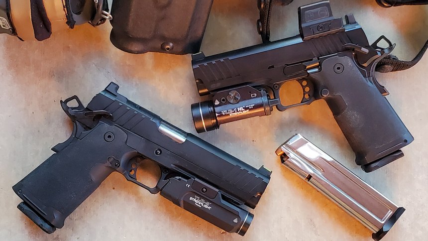 Both the 5.0 (left) and the 4.25 (right) pistols were evaluated. The 5" model has a Streamlight TLR-9 attached and is shown using the fixed rear sight plate. The 4.25" gun has a Streamlight TLR-1HL attached. It also has the Holosun HE509T installed.