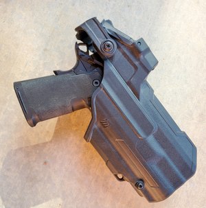 The 4.25" is shown in the Blackhawk T-Series holster. In this instance, the TLR-1HL has been replaced with a Surefire X300U-B light. The Blackhawk holster will only work properly with the Surefire light. 