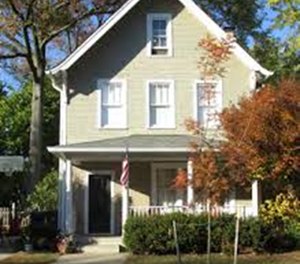 Note the window at the peak of the roof, which, along with the steep pitched roof, can be easy indicators of knee walls being present.
