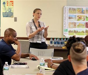 Zoe Maher, a Temple trauma surgeon, explains the Philadelphia Immediate Transport in Penetrating Trauma Trial to community leaders. The study will ask: When gunshot victims are rushed to the emergency room, could paramedics do more to save them by doing less? (AP Photo/ Joseph Kaczmarek)

