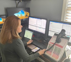 When remote dispatch went live, Arlington’s fire dispatcher at home had another fire dispatcher sitting in the ECC – just in case there was a disconnect, the ECC dispatcher could instantaneously take over. (Photo/Arlington County Emergency Communications Center)