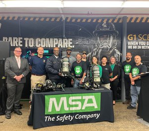 Pittsburgh Bureau of Fire Chief Darryl Jones receives one of the new MSA G1 SCBA units from MSA Murrysville employees. MSA Safety manufactures the G1 SCBA at the Murrysville plant and has shipped more than 220,000 G1 units since 2014.