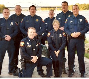 The author (kneeling) is pictured here with the last group of officers he helped field train before retiring.