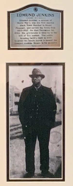 A plaque and photo honor Edmund Jenkins, the first Black police officer in Mount Pleasant, South Carolina.