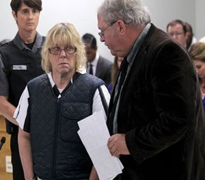 Joyce Mitchell stands with her lawyer Steven Johnston, appearing before Judge Buck Rogers in Plattsburgh City Court, New York, for a hearing Monday June 15, 2015.