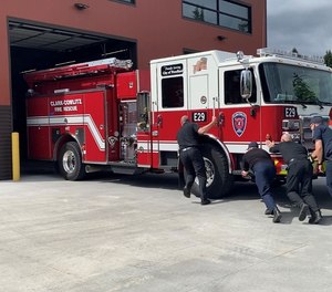 On May 25, 13 firefighters and Woodland City Administrator Pete Boyce pushed the 38,000 pound new engine into the Scott Avenue station's bay without the motor on, as part of the department's tradition.
