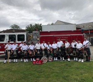 Members of the Greater Boston Firefighters Pipes and Drums who helped save a man's life on Saturday.