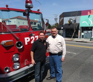 Jesse Quinalty (left) and John Salka, FDNY battalion chief (ret.), ride around Los Angeles in a 1972 Crown Firecoach. (Photo/Jesse Quinalty)