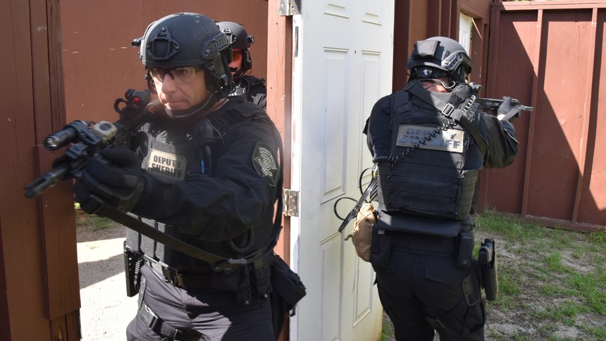 Corporal Peter Hart and other SRT operators practice room-clearing techniques during tactical operations training at RCSD’s weapons qualification range.