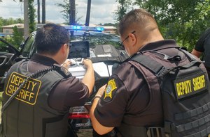 Cpl. Marcus Kim, RCSD's drone pilot, monitors real-time images sent from the drone circling the school.