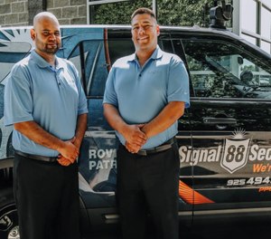 Roger Estrada (right) operates a successful business enterprise.