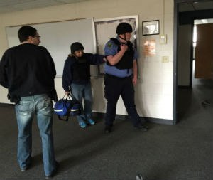 Medics and police officers practice the rescue task force method for finding and treating patients in the warm zone during an active-shooter incident.