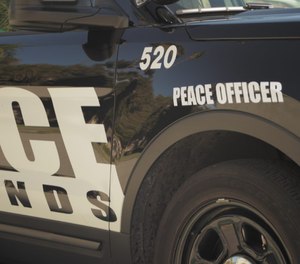 Redlands Police Department squad car with Peace Officer decal.