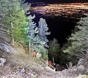 Albuquerque Mountain Rescue Council members undertake a night rescue on the mountains overlooking Albuquerque.