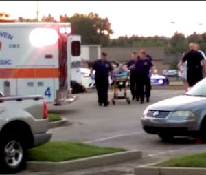 Bystander video of Miss. man in hogtie restraints on the ambulance cot.