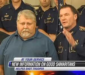 In this screen grab from KPLC-TV, state police chief Mike Edmonson stands with Robert Ledoux, the good Samaritan who helped capture a man accused of shooting Senior Trooper Steven Vincent.
