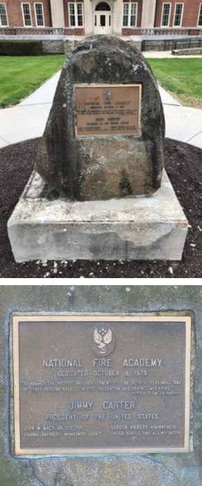 The plaque features a quote from Public Law 93-498 1974 creating the Nation Fire Prevention and Control Administration, stating the purpose of the NFA.