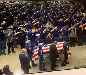 The funeral for John "Rocky" Riojas, who was shot and killed during an altercation with a burglary suspect in February 2001.